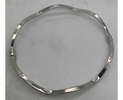 A 9ct white gold bangle. 4gm.Condition ReportGood condition.