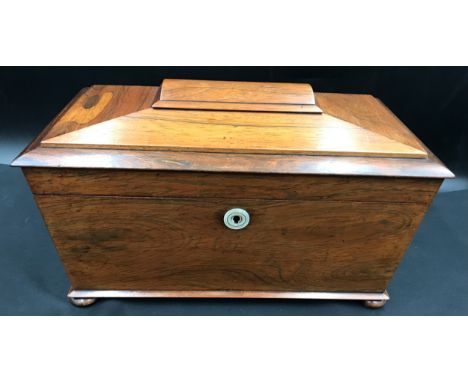 A rosewood mahogany sarcophagus tea caddy with two compartments, glass jar. 34 w x 18 d x approx. 21cm h.Condition ReportGood
