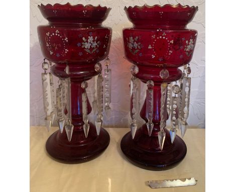 A pair of Victorian ruby glass lustres with enamelled floral decoration to top. 36cm h.Condition ReportSome drops a/f.