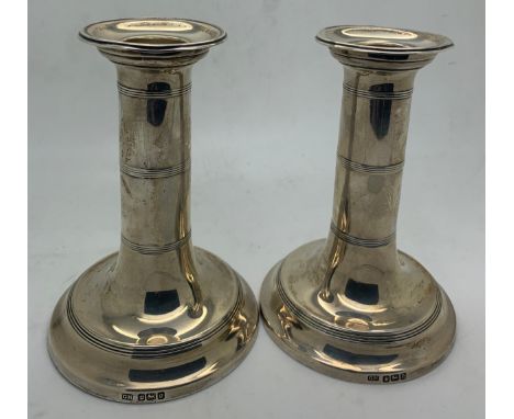 Pair of silver candlesticks, Sheffiels 1906, maker Harrison Bothers &amp; Howson, 12cm h. Weighted bases.Condition ReportSlig