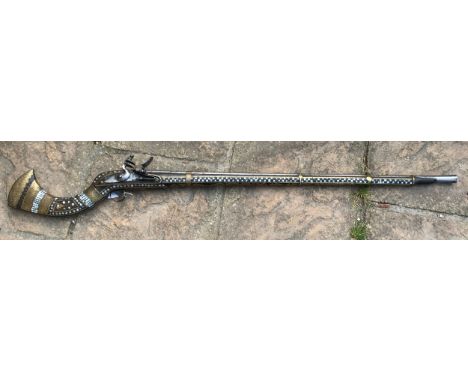 Northwest Frontier musket with a 41'' barrel, stock heavily decorated with inlaid brass and mother of pearl, East India Compa