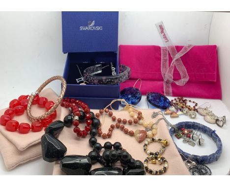 A boxed lot of costume jewellery to include: Swarovski pendant, earrings, crucifix, bracelets, Lola Rose earrings bracelet an