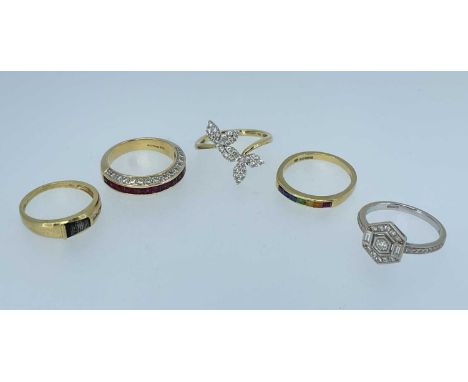 FIVE 18K GOLD RINGS comprising two diamond set rings, diamond and ruby ring, multi-gem ring and another diamond set ring, 17.