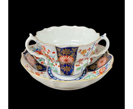 WORCESTER KAKIEMON PORCELAIN CHOCOLATE CUP & SAUCER, c. 1770-80, decorated in the 'Rich Queens' pattern in underglaze blue an