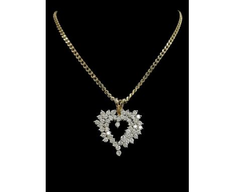 14K GOLD DIAMOND ENCRUSTED HEART SHAPED PENDANT, set with approximately fifty diamonds (0.04-0.05cts each approx.), on a 9ct 