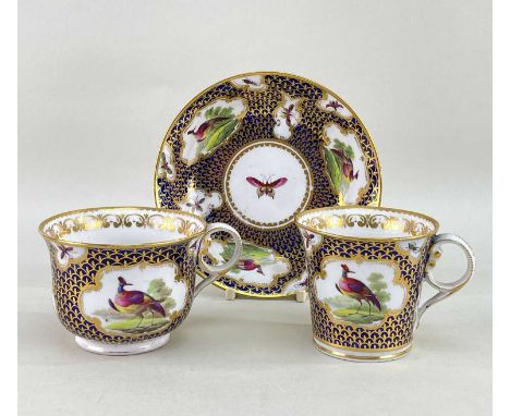 CHAMBERLAIN WORCESTER PORCELAIN TRIO, c. 1810, comprising tea cup, saucer and coffee cup, overall decorated with reserves of 