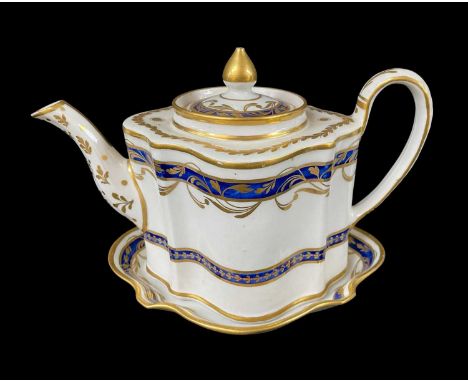 NEW HALL PORCLEAIN TEAPOT, COVER &amp; STAND, c. 1800, of silver shape, painted with gilt foliate and mazaine blue bands, 24.