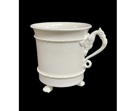 BELEIVED SWANSEA PORCELAIN CABINET CUP circa 1815-1817, raised over three claw feet and with gryphon handle with spread-out w