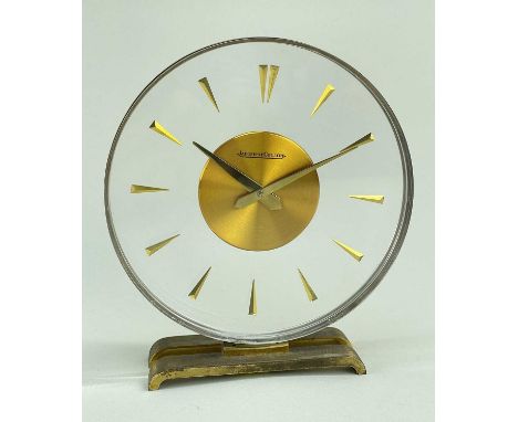 JAEGER LECOULTRE 'MYSTERY' CLOCK, circular perspex dial, baton numerals, gilt base, 15cm hComments: base worn gilt, ticking w