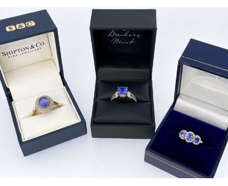 THREE 9CT TANZANITE RINGS, comprising 3-stone, single oval stone and cushion cut square stone rings, tot gross wt. 7.7g (3)Co