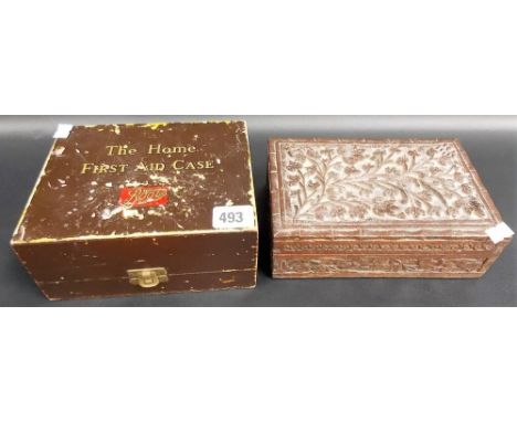 Vintage Boots Chemists ' The Home First Aid Case' complete with its fittings, together with an Eastern carved wood rectangula
