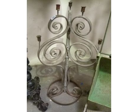 Wrought iron candelabra with three scroll supports, height 32'