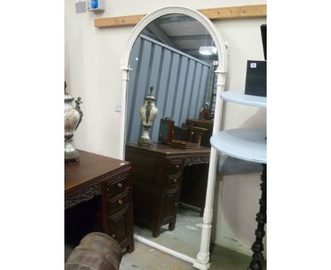 19th Century tall arched mirror, the white painted moulded frame with half fluted and stiff leaf collar pillars, the arch wit