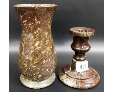 A Cornish red serpentine turned squat candlestick, height 4.5'; together with a Cornish serpentine vase (2)