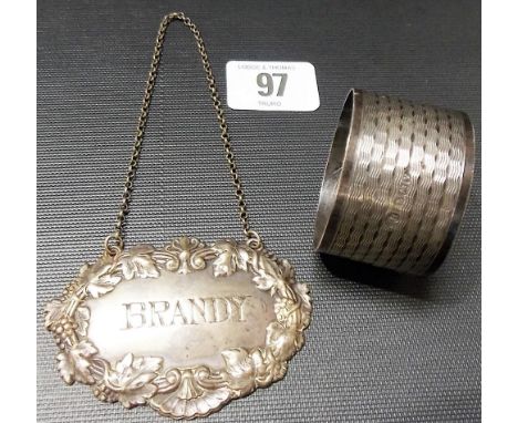 Edwardian silver 'BRANDY' spirit label, the rim case with fruiting vine, maker HA, Sheffield 1909; together with a silver eng