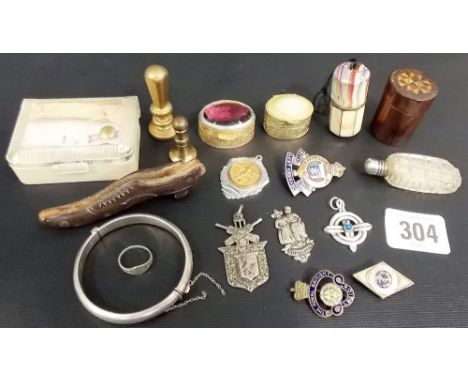 Miscellaneous small items including two brass seals, a child's silver bangle, an enamelled metal thimble holder etc.,