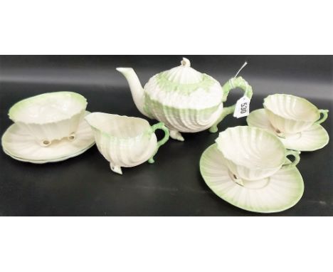 Belleek Neptune porcelain tea set for two, each shell moulded with naturalistic handles and green blush painted, comprising t