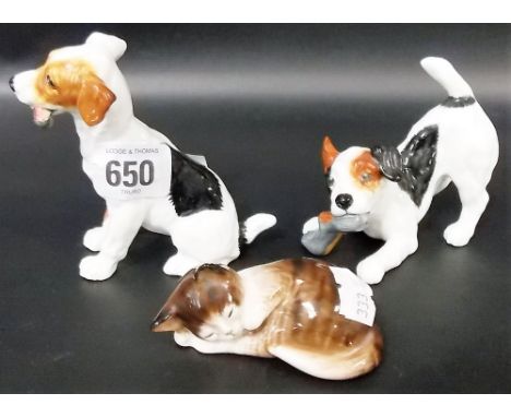 Two Royal Doulton terrier dogs, one seated with a bone in his mouth, the other playing with a slipper, H.N. 1159 and H.N. 265