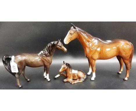 Beswick Pottery model of a bay horse, height 8.5' (ear af); together with a Beswick Pottery reclining foal and a pony (3)