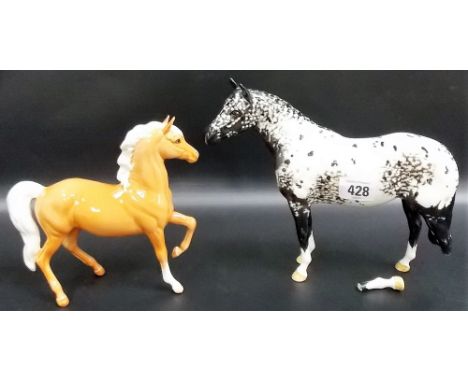Beswick Pottery model of a black and white dappled horse (left back leg af) together with a Beswick Pottery model of a palomi
