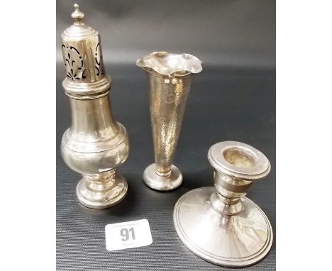 Silver pedestal sugar caster, Birmingham 1937; together with a silver weighted squat candlestick and a Hong Kong sterling sil