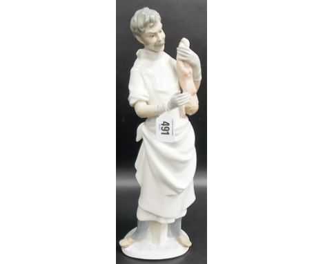 Lladro porcelain group depicting an obstetrician with newborn baby, height 14'