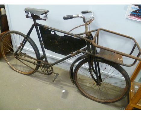 A vintage butcher's bike with front basket