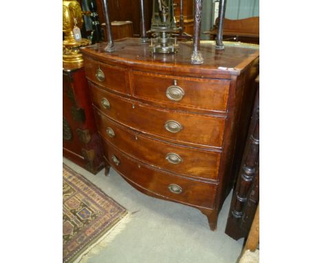 George III mahogany cross banded bow front chest of two short over three long graduated drawers upon splayed bracket feet, wi