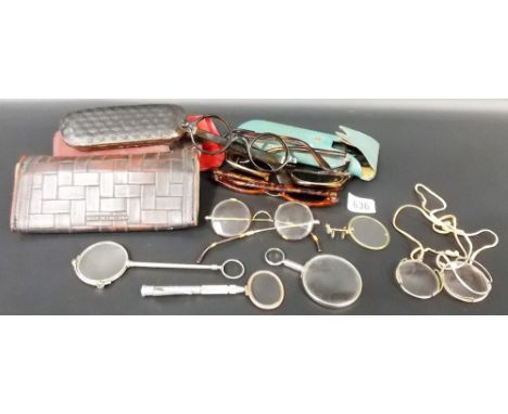 A collection of vintage spectacles and sunglasses including a pair of sunglasses by Christian Dior, a quizzing glass and a pa