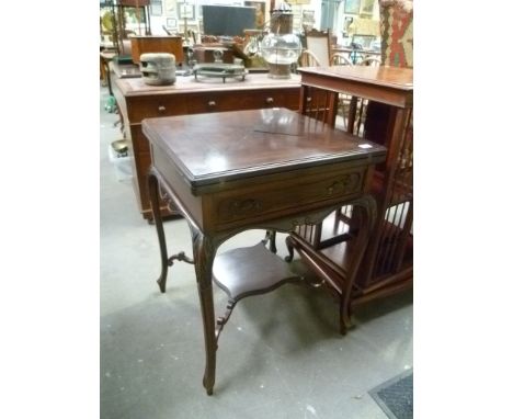Edwardian walnut envelope card table with frieze drawer