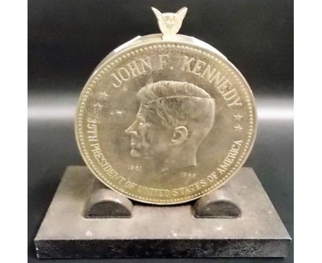 John F. Kennedy 1961 - 1963 chrome plated medallion table lighter upon cast iron stand, one side decorated with the bust of J