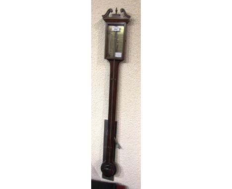 A MAHOGANY STICK BAROMETER/THERMOMETER  with broken swan neck pediment, the brass register inscribed 'thos. Wright Sarum'