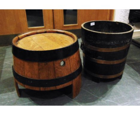 A COPPER BOUND OAK PLANTER  35cm diameter 38cm high; together with a coopered oak barrel converted to occasional table
