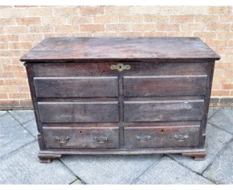 A LARGE OAK MULE CHEST  with two drawers to base beneath four faux drawers, flanked by fluted pilasters, on ogee bracket feet