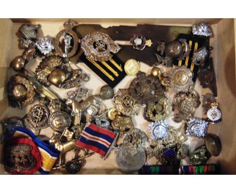 MILITARIA - ASSORTED CAP BADGES &amp; OTHER ITEMS   including a War Medal 1939-45; pips; buttons; and two brass button sticks