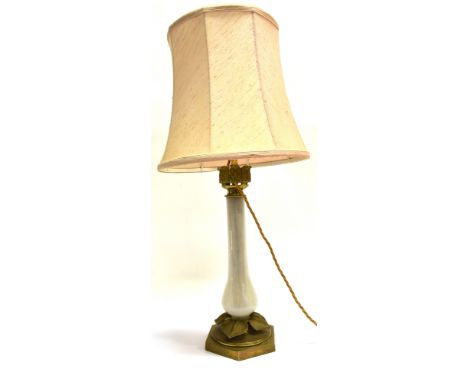 A DECORATIVE TABLE LAMP  with opaque glass stem and gilt metal base modelled as a lotus flower, 44cm high