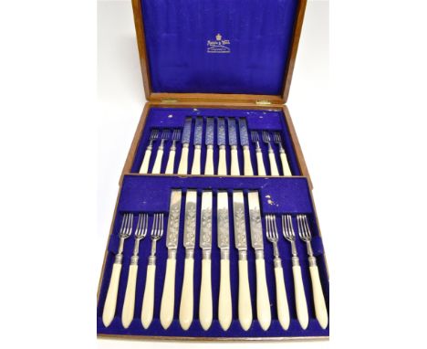 A SET OF TWELVE MAPPIN &amp; WEBB SILVER AND IVORY HANDLED TEA KNIVES AND FORKS with foliate engraved blades and tines, mark 