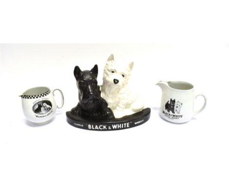 BREWERIANA - A BLACK &amp; WHITE SCOTCH WHISKEY 'DOG' BAR TOP GROUP by Brentleigh Ware, 22cm high by 30cm wide; two black and