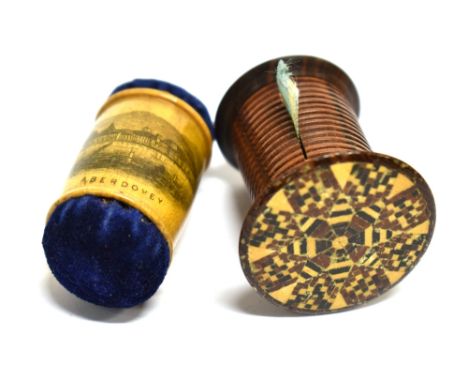 SEWING - A TUNBRIDGE WARE TAPE MEASURE  of capstan type, with a multi-ring rosewood body, circular mosaic top and blue silk p