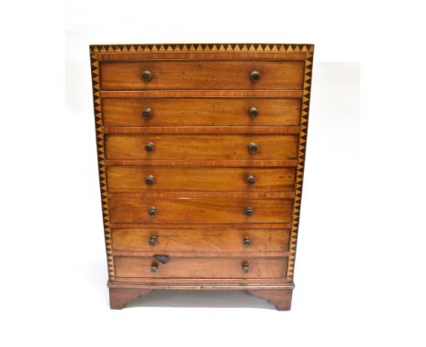 A VICTORIAN MAHOGANY TABLE TOP COLLECTORS CABINET  fitted with seven drawers, with parquetry and crossbanded decoration, on b