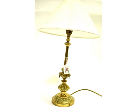 AN EDWARDIAN BRASS TABLE LAMP  with classical swag decoration, 38cm high excluding electrical fitting