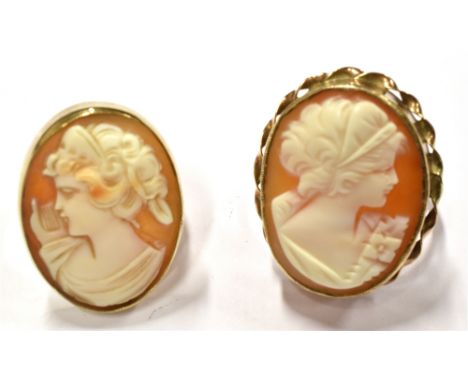TWO GOLD AND SHELL CAMEO OVAL RINGS, ONE DEPICTING THE MUSE ERATO  facing left with a lyre near her right shoulder, rub-over 
