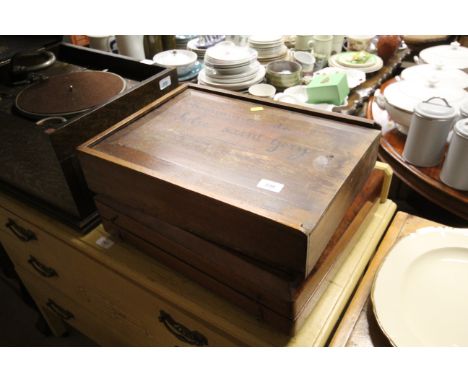 A mahogany backgammon box and an elm storage box with sliding lid and French inscription 