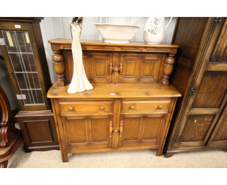 A small Ercol court cupboard 