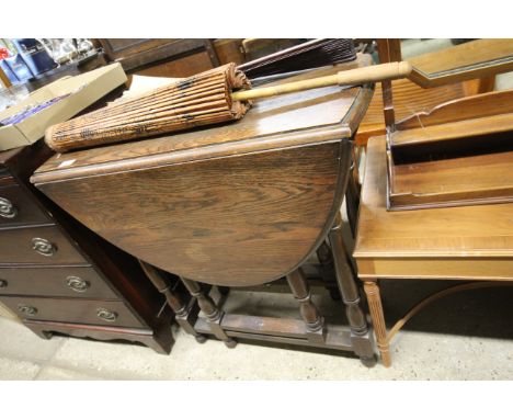 A 1930's oak gate leg tea table