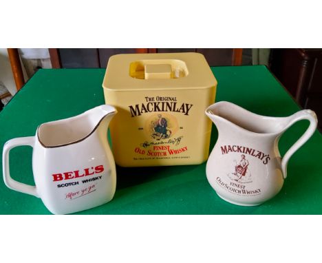 The Mackinlay Finest Old Scotch Whisky ice bucket; Mackinlay whisky water jug by Seton Pottery; a Bell's water jug by Wade (3