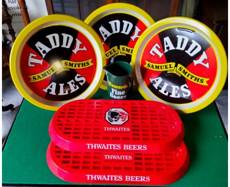 Thwaites drip trays in mint condition; Three Taddy Ales and an Everards Fine Beer water jug by Wade (6) Excellent Condition.