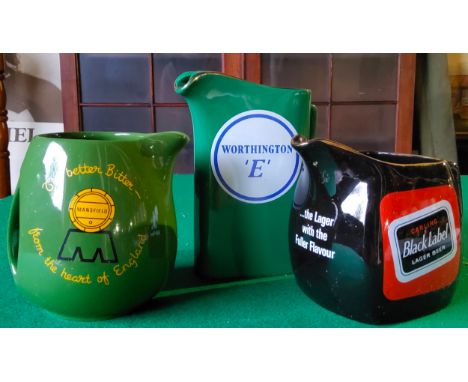 A Worthington 'E' whisky water jug by Wade PDM; Carling Black Label jug by Wade; a Mansfield Brewery 'The Better Beer From Th