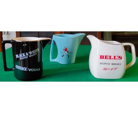 Three Wade ceramic whisky water jugs including a powder blue Johnnie Walker whisky example, Bell's and another showing variou