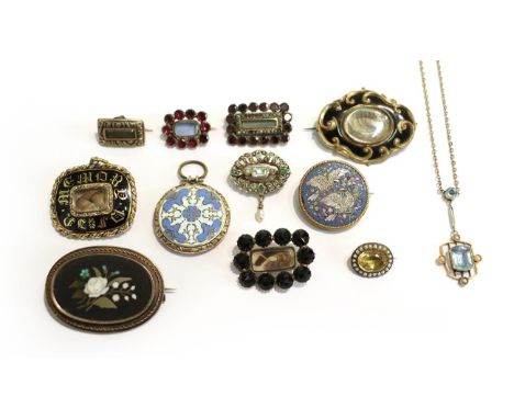 A collection of jewellery including two Victorian memorial brooches, five slide brooches, circa 1830, set with garnet, jet, s